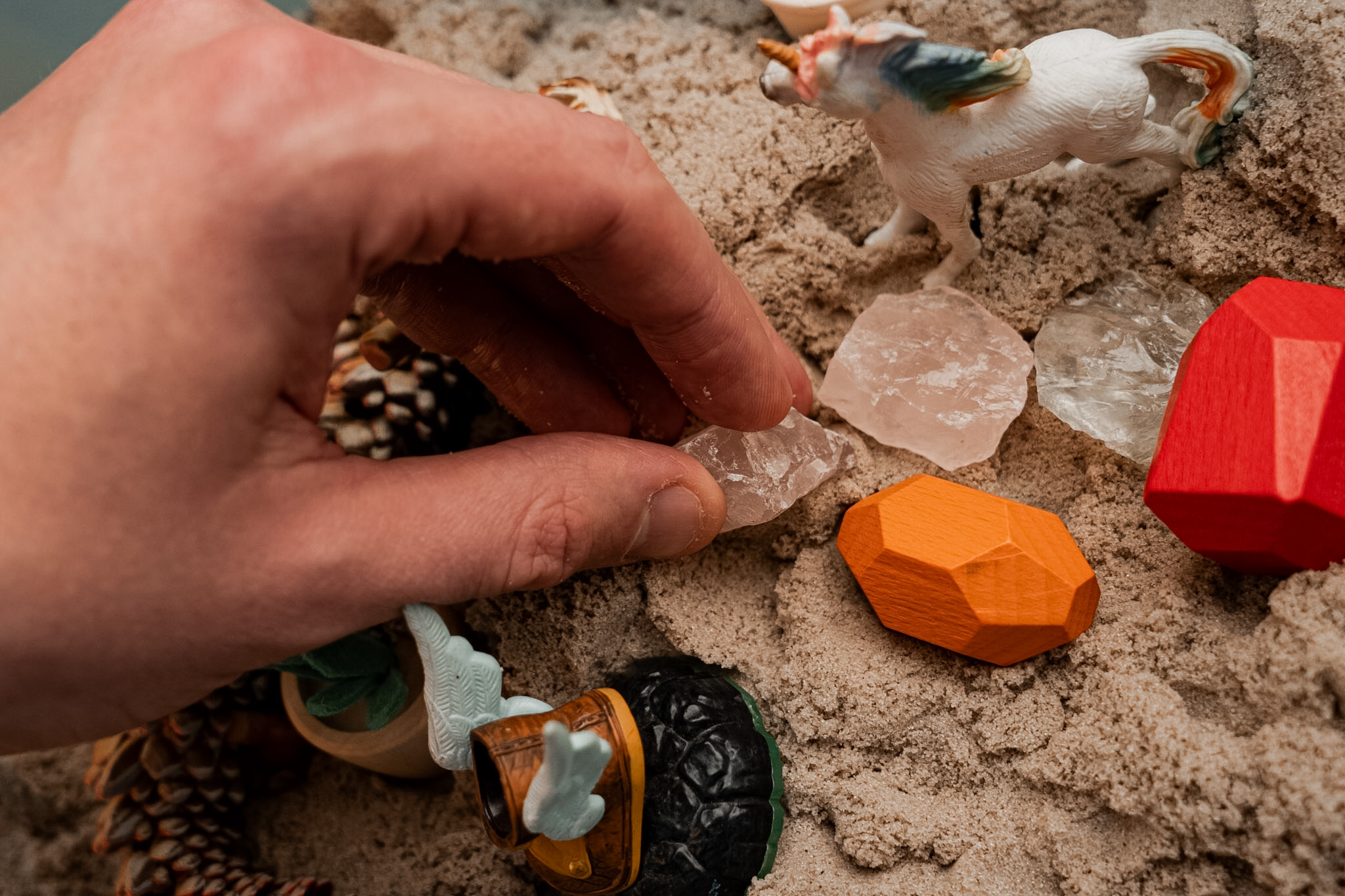 Sandtray therapy materials arranged for creative therapeutic work